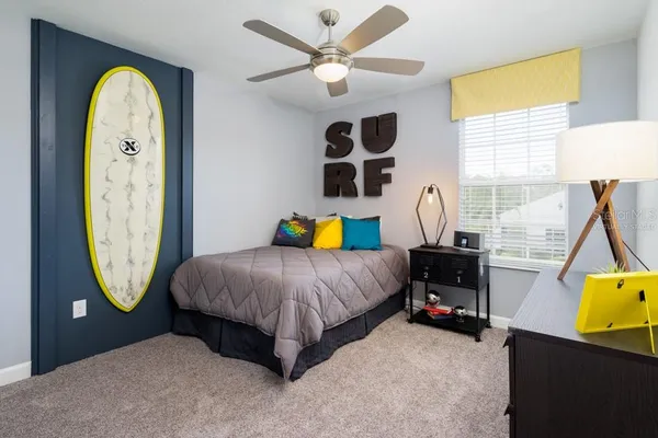 a bedroom with bed and a window