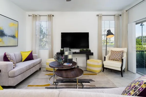 a living room with furniture and a flat screen tv