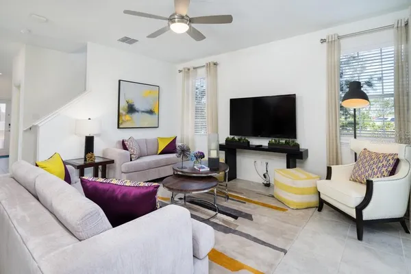 a living room with furniture and a flat screen tv