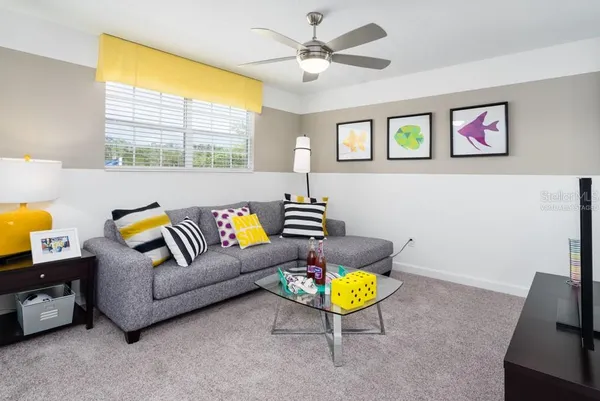 a living room with furniture and a window