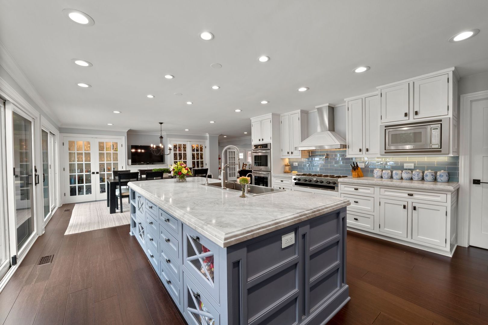 620 West Old Elm Road Lake Forest, IL 60045 - Photo 18 of 77 a kitchen with kitchen island granite countertop lots of counter top space and stainless steel appliances