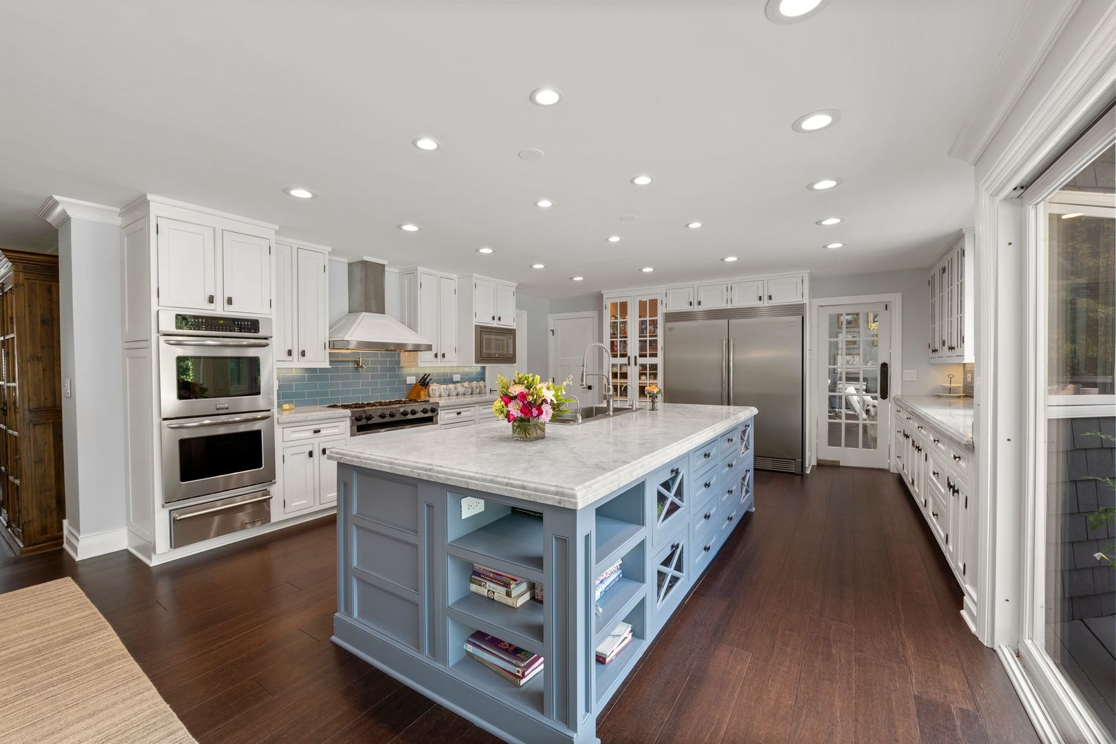 620 West Old Elm Road Lake Forest, IL 60045 - Photo 20 of 77 a large white kitchen with a stove a sink a refrigerator and white cabinets
