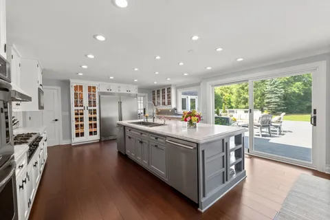 a bedroom with furniture and a rug