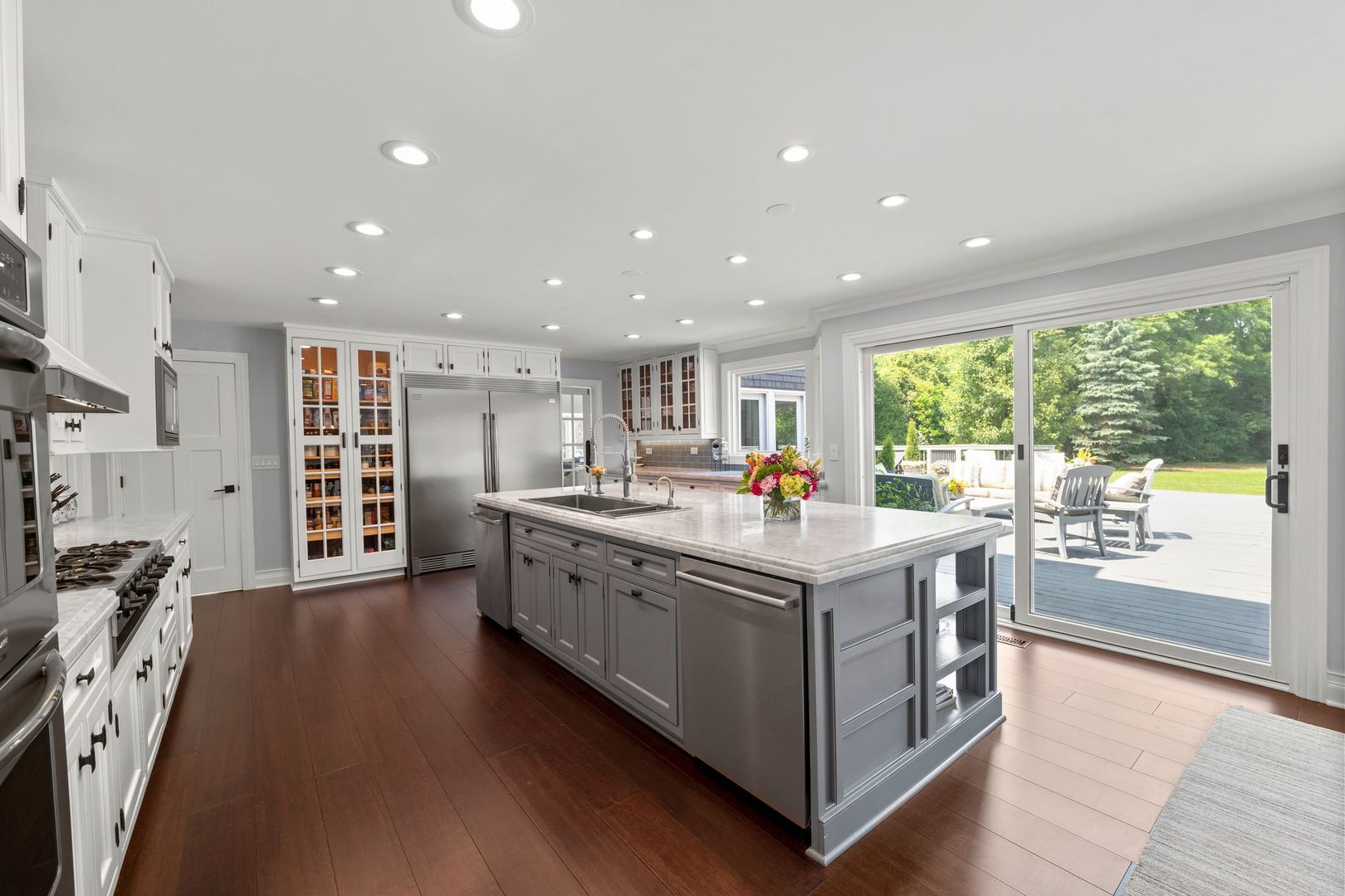 620 West Old Elm Road Lake Forest, IL 60045 - Photo 22 of 77 a kitchen with stainless steel appliances granite countertop a stove and a large refrigerator