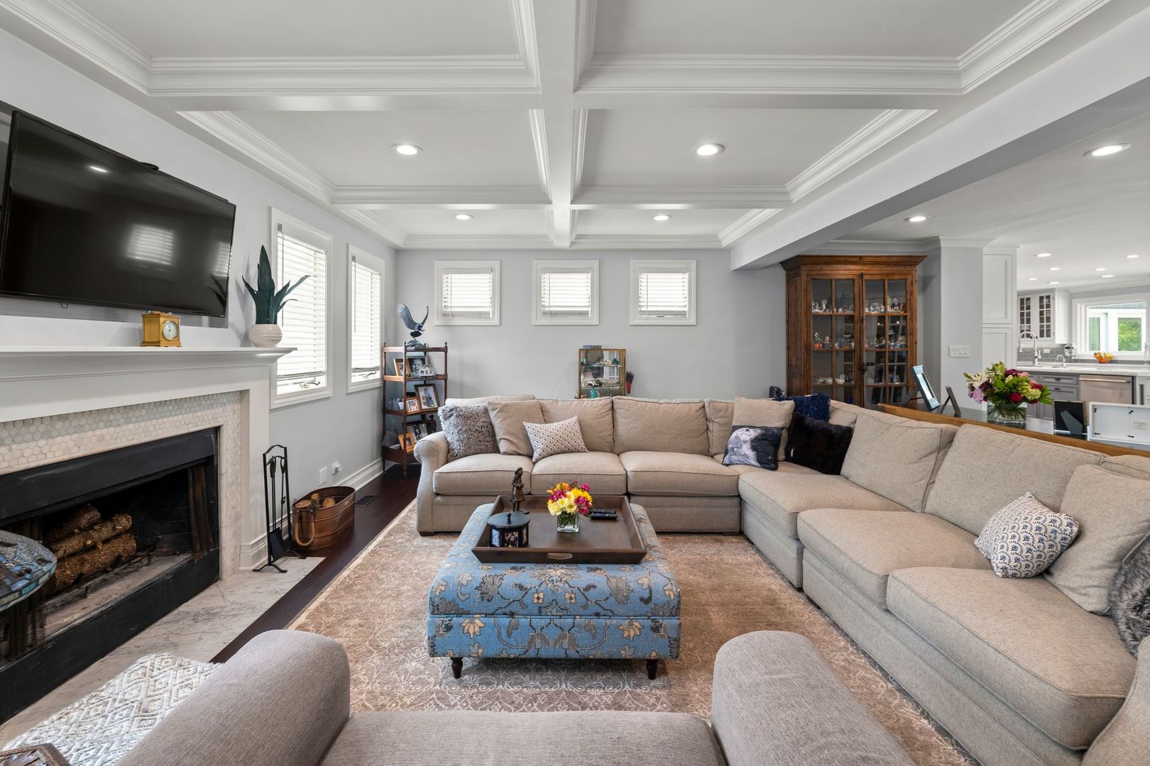 620 West Old Elm Road Lake Forest, IL 60045 - Photo 27 of 77 a living room with furniture a flat screen tv and a fireplace