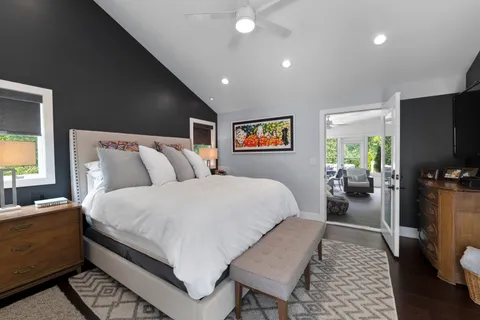 a bedroom with a bed and window