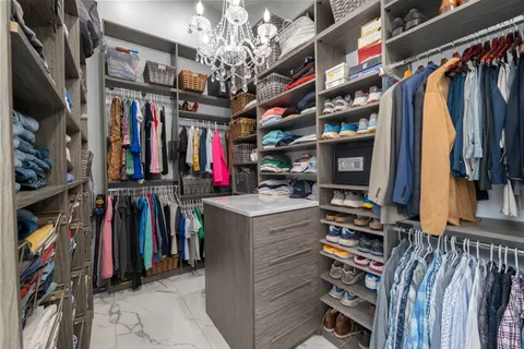 a spacious bathroom with a granite countertop sink a toilet and a mirror