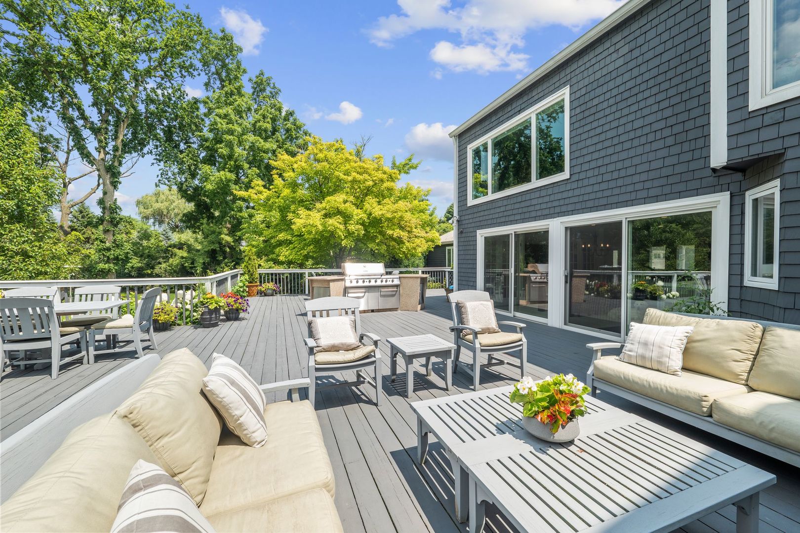 620 West Old Elm Road Lake Forest, IL 60045 - Photo 56 of 77 a view of a patio with couches and a table and chairs with wooden floor