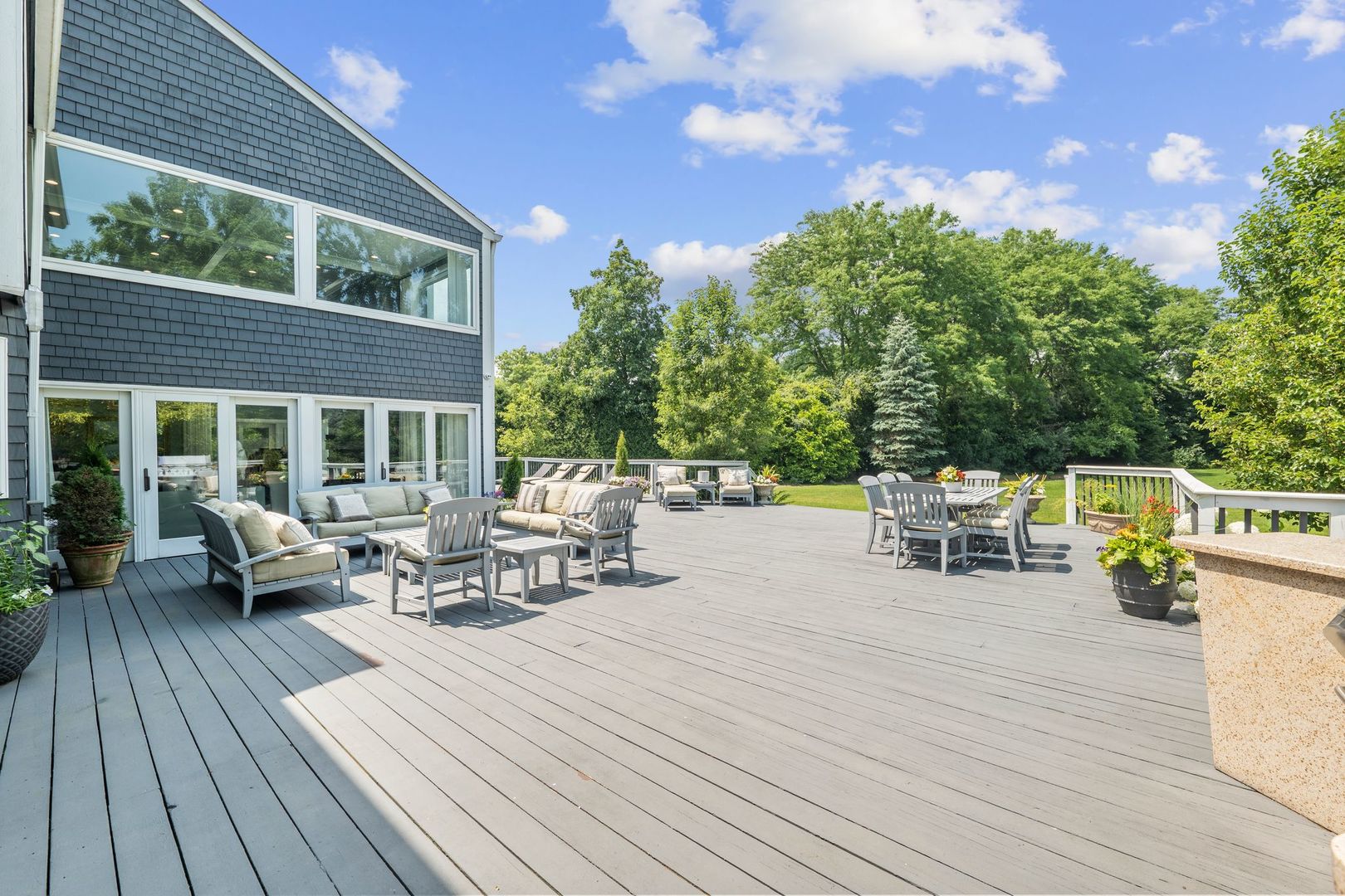 620 West Old Elm Road Lake Forest, IL 60045 - Photo 58 of 77 a view of a deck with table and chairs with wooden floor and fence