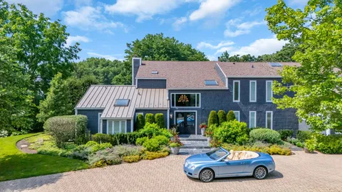 a living room with fireplace furniture and a flat screen tv
