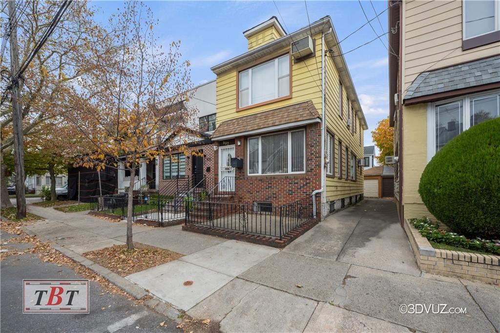 a view of a brick house with many windows