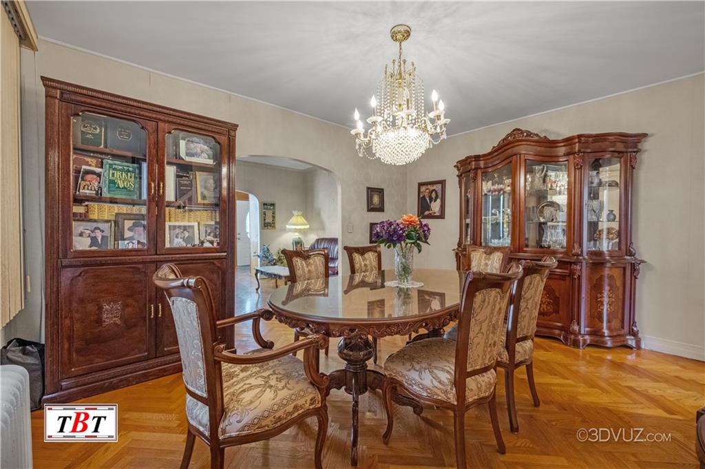 907 Ave. M Brooklyn, NY 11230 - Photo 11 of 22 a view of a dining room with furniture and chandelier