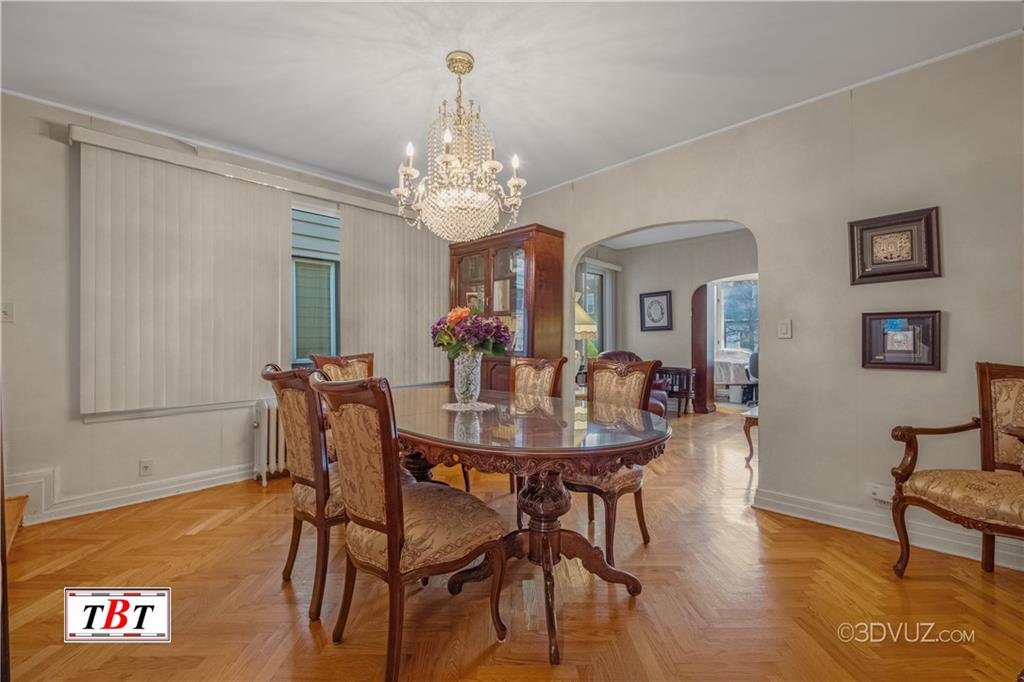 907 Ave. M Brooklyn, NY 11230 - Photo 12 of 22 a view of a dining room with furniture and chandelier