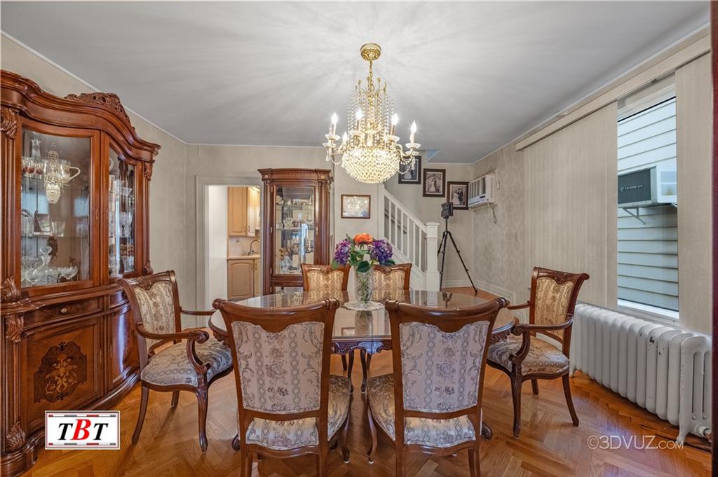 907 Ave. M Brooklyn, NY 11230 - Photo 13 of 22 a view of a dining room with furniture and chandelier