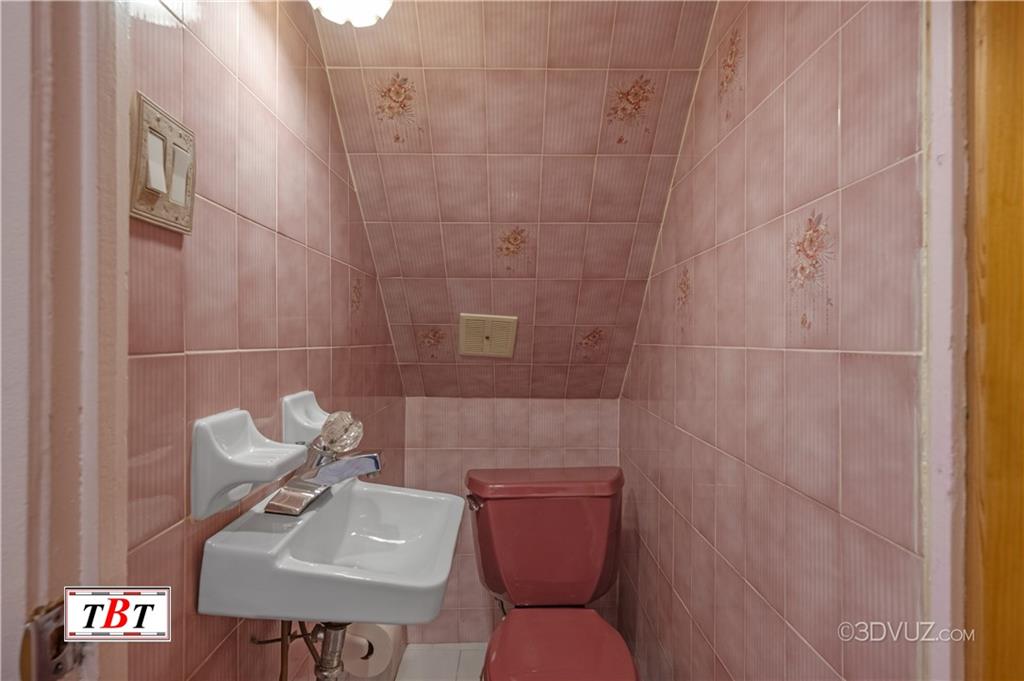 907 Ave. M Brooklyn, NY 11230 - Photo 14 of 22 a bathroom with a sink mirror and toilet