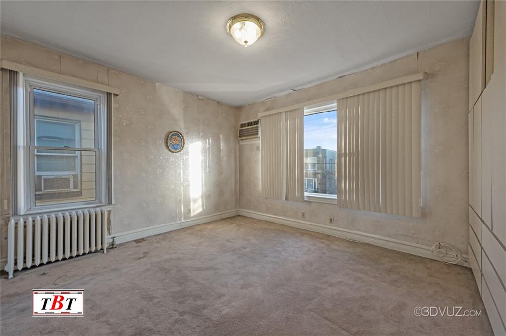 907 Ave. M Brooklyn, NY 11230 - Photo 16 of 22 an empty room with windows and entrance