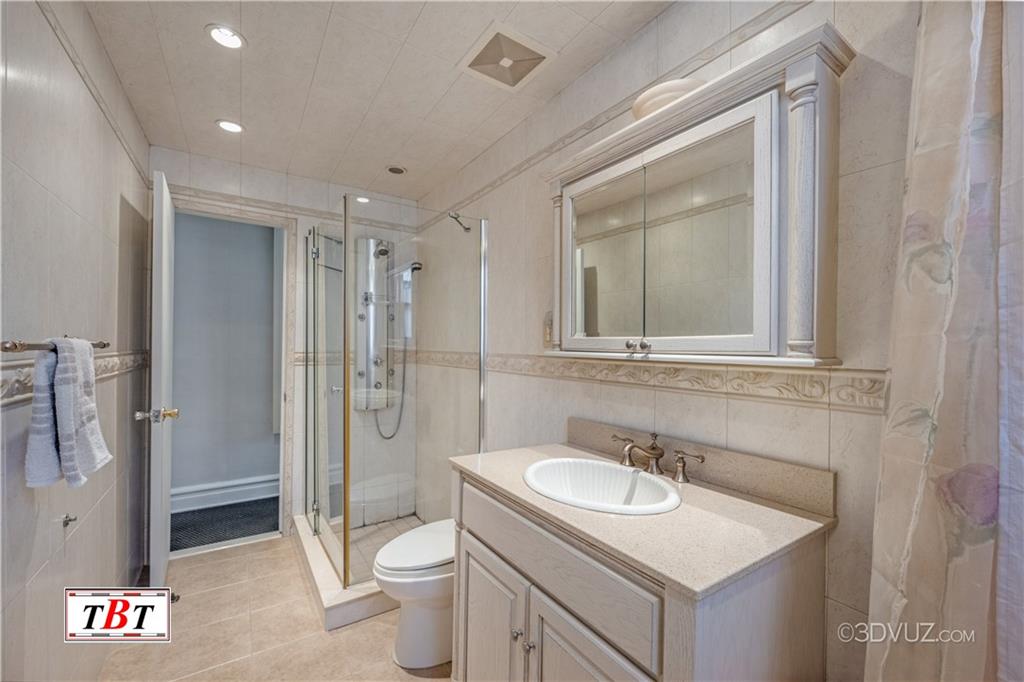 907 Ave. M Brooklyn, NY 11230 - Photo 19 of 22 a bathroom with a sink toilet and shower