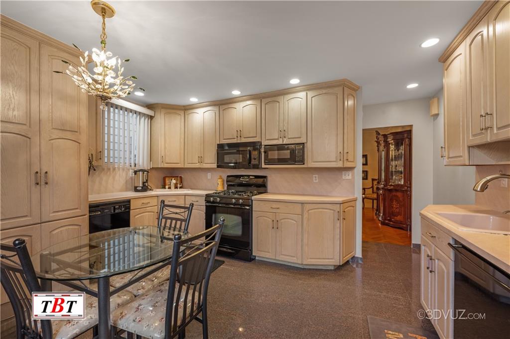 907 Ave. M Brooklyn, NY 11230 - Photo 7 of 22 a kitchen with a sink stainless steel appliances and cabinets