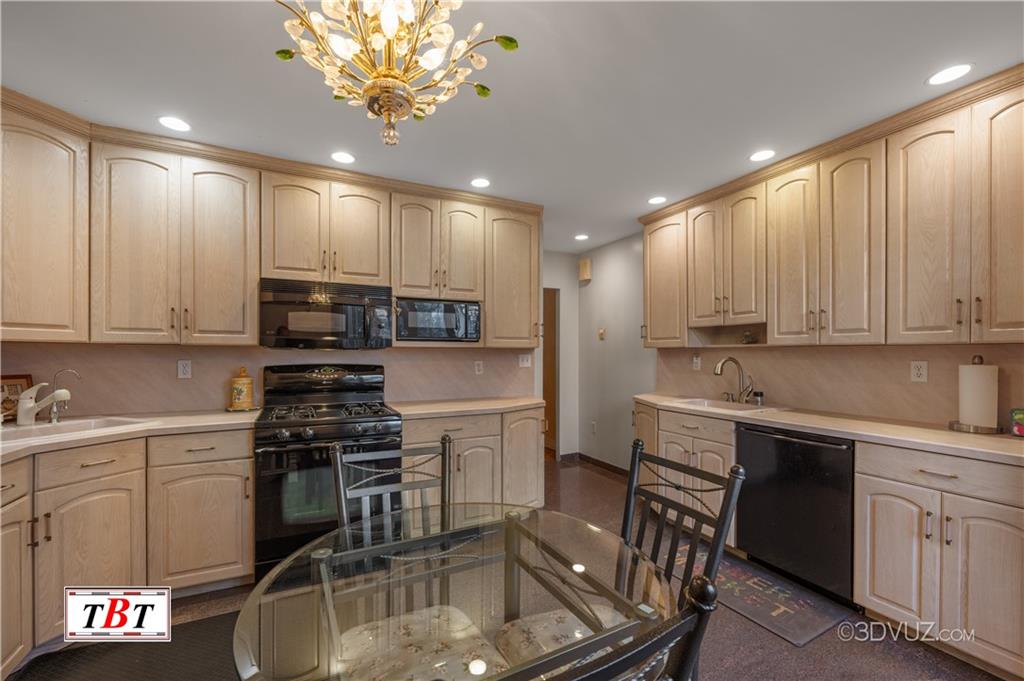 907 Ave. M Brooklyn, NY 11230 - Photo 9 of 22 a kitchen with kitchen island granite countertop a sink stainless steel appliances and cabinets