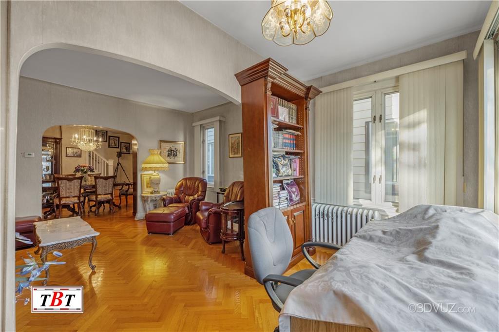 907 Ave. M Brooklyn, NY 11230 - Photo 10 of 22 a bedroom with furniture and a window