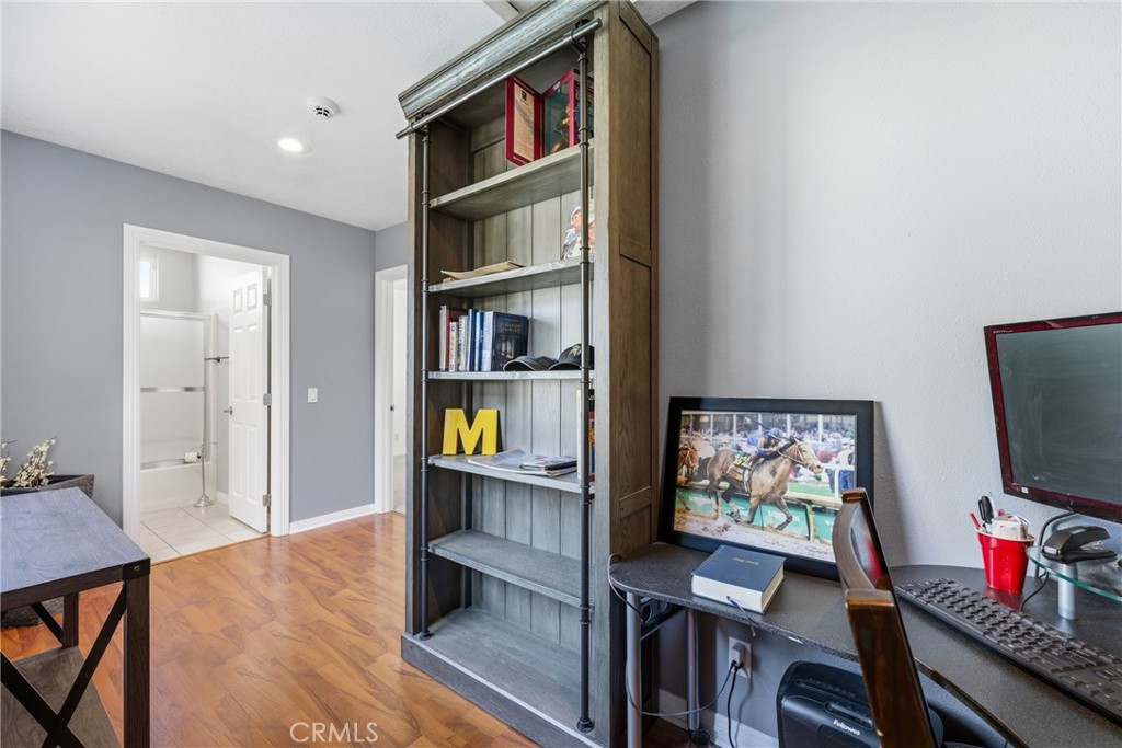3465 Conata Street Duarte, CA 91010 - Photo 17 of 36 a view of a workspace with furniture and a book shelf