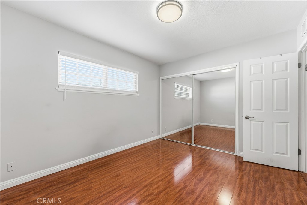 3465 Conata Street Duarte, CA 91010 - Photo 22 of 36 an empty room with wooden floor and windows