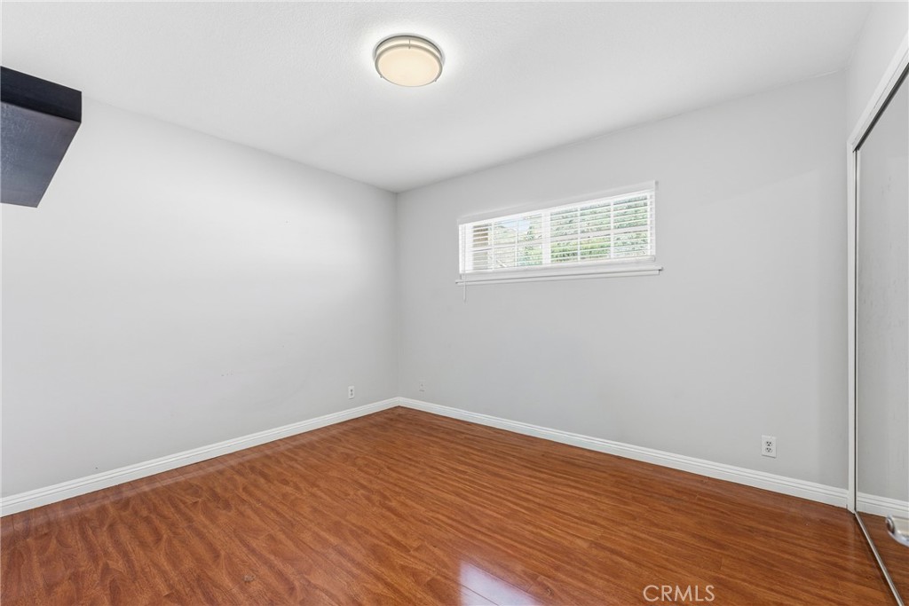 3465 Conata Street Duarte, CA 91010 - Photo 23 of 36 an empty room with wooden floor and windows