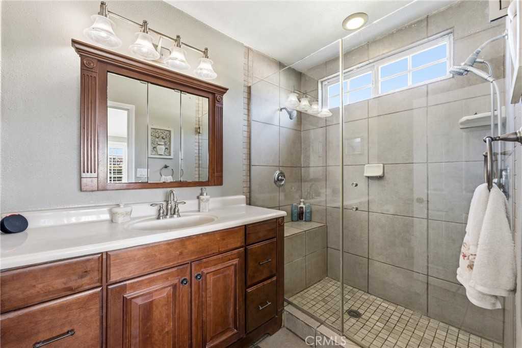 3465 Conata Street Duarte, CA 91010 - Photo 25 of 36 a bathroom with a double vanity sink mirror and shower