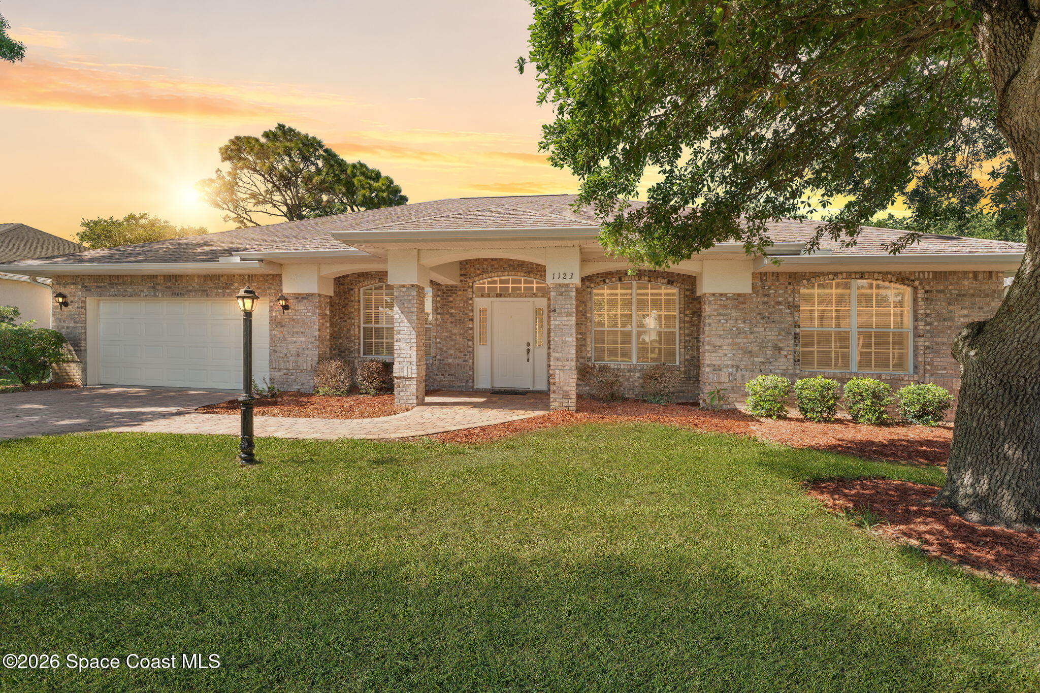 1123 Spring Oak Drive Melbourne, FL 32901 - Photo 1 of 67 a house view with a garden space