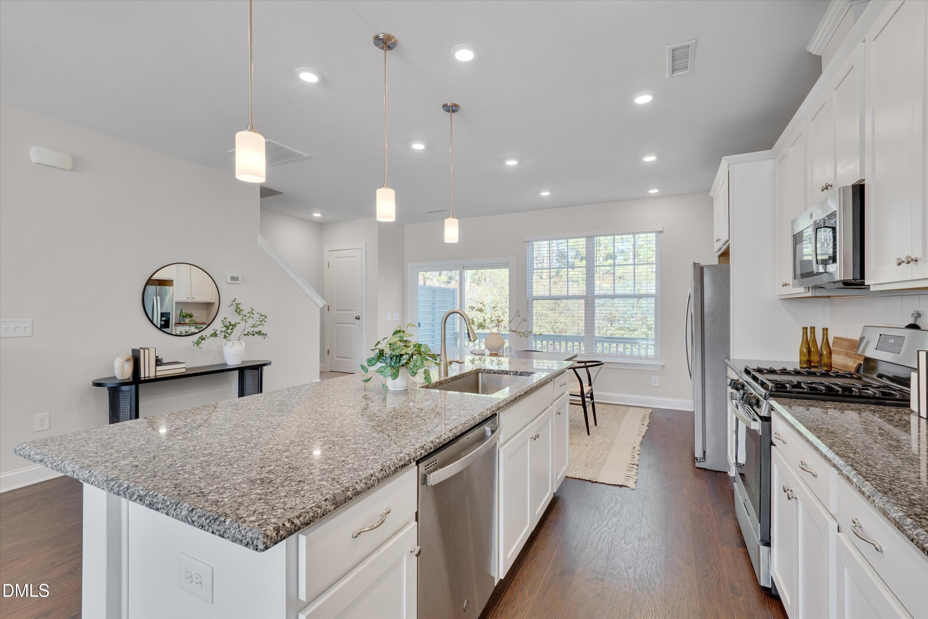 2819 Dallas Valley Lane Apex, NC 27502 - Photo 13 of 38 a kitchen with sink stove and cabinets