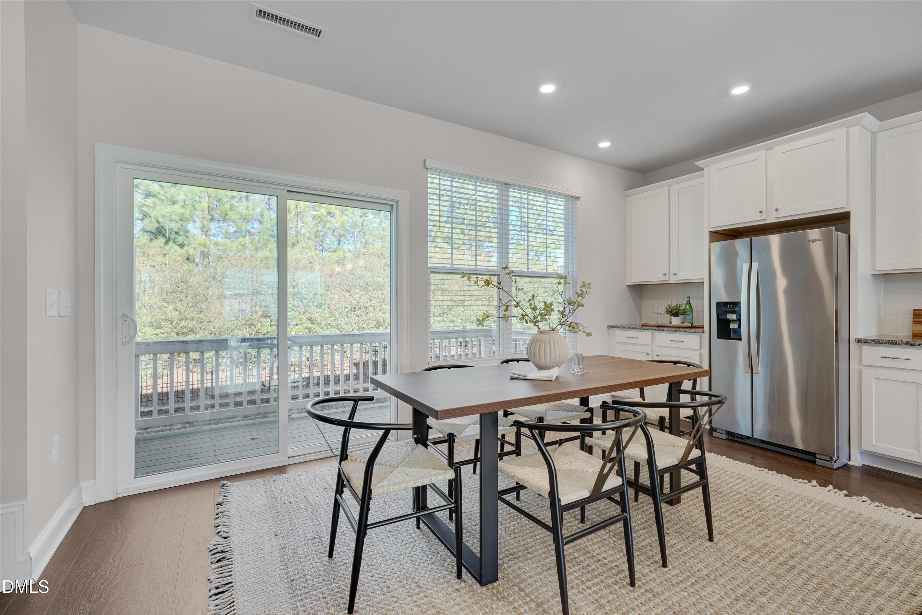 2819 Dallas Valley Lane Apex, NC 27502 - Photo 16 of 38 a view of a dining room with furniture and wooden floor
