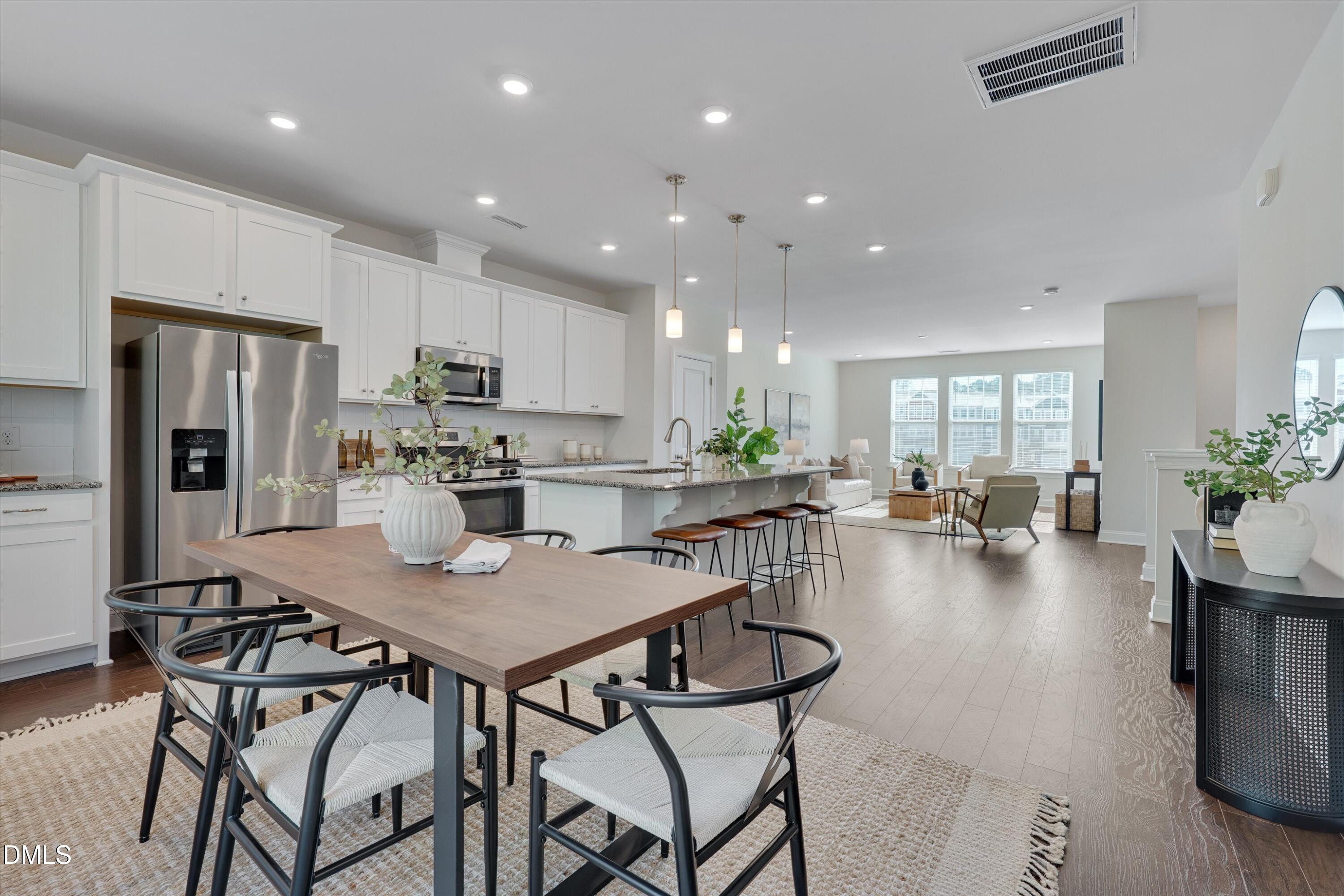 2819 Dallas Valley Lane Apex, NC 27502 - Photo 17 of 38 a view of kitchen dining table and chairs