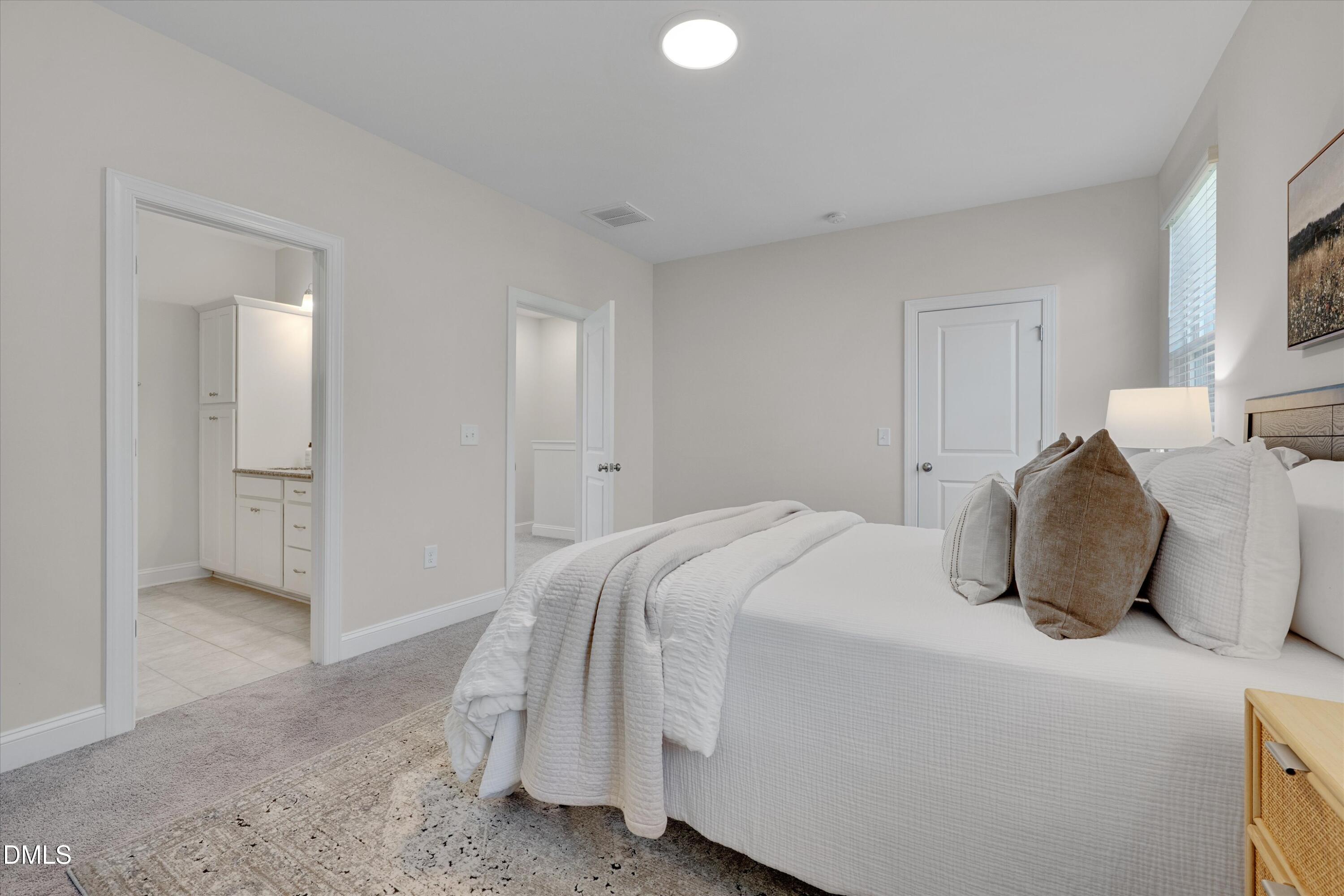 2819 Dallas Valley Lane Apex, NC 27502 - Photo 23 of 38 a bedroom with a bed and closet