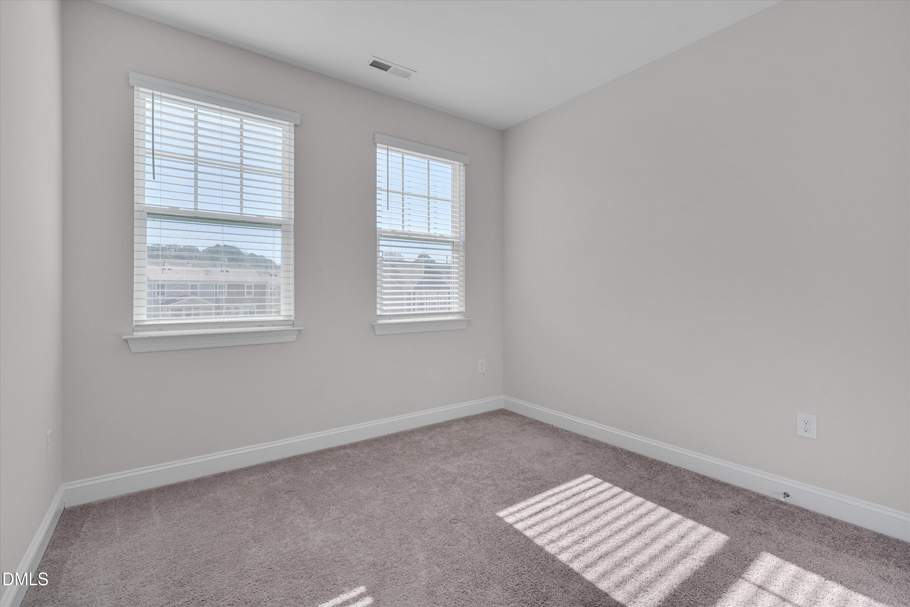 2819 Dallas Valley Lane Apex, NC 27502 - Photo 26 of 38 an empty room with windows
