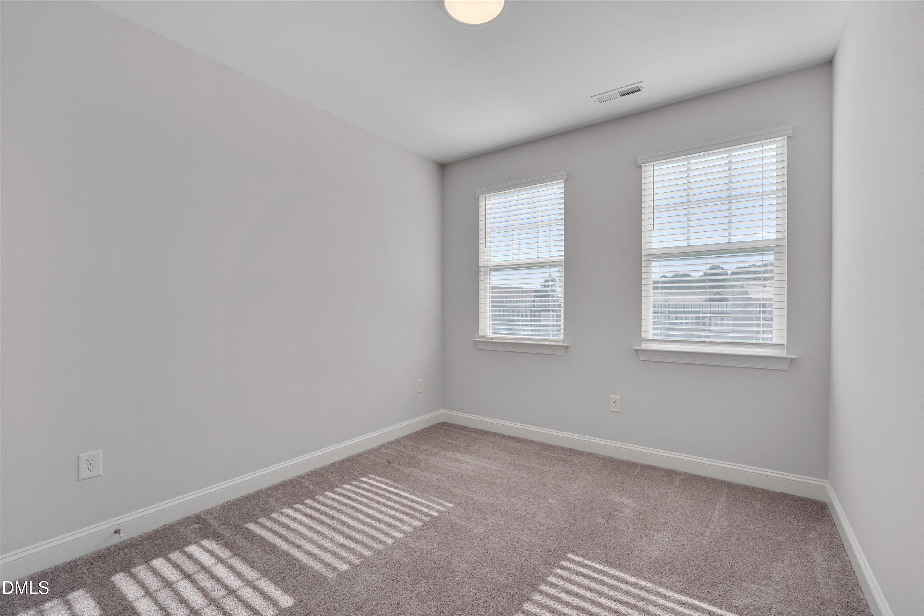 2819 Dallas Valley Lane Apex, NC 27502 - Photo 29 of 38 an empty room with windows