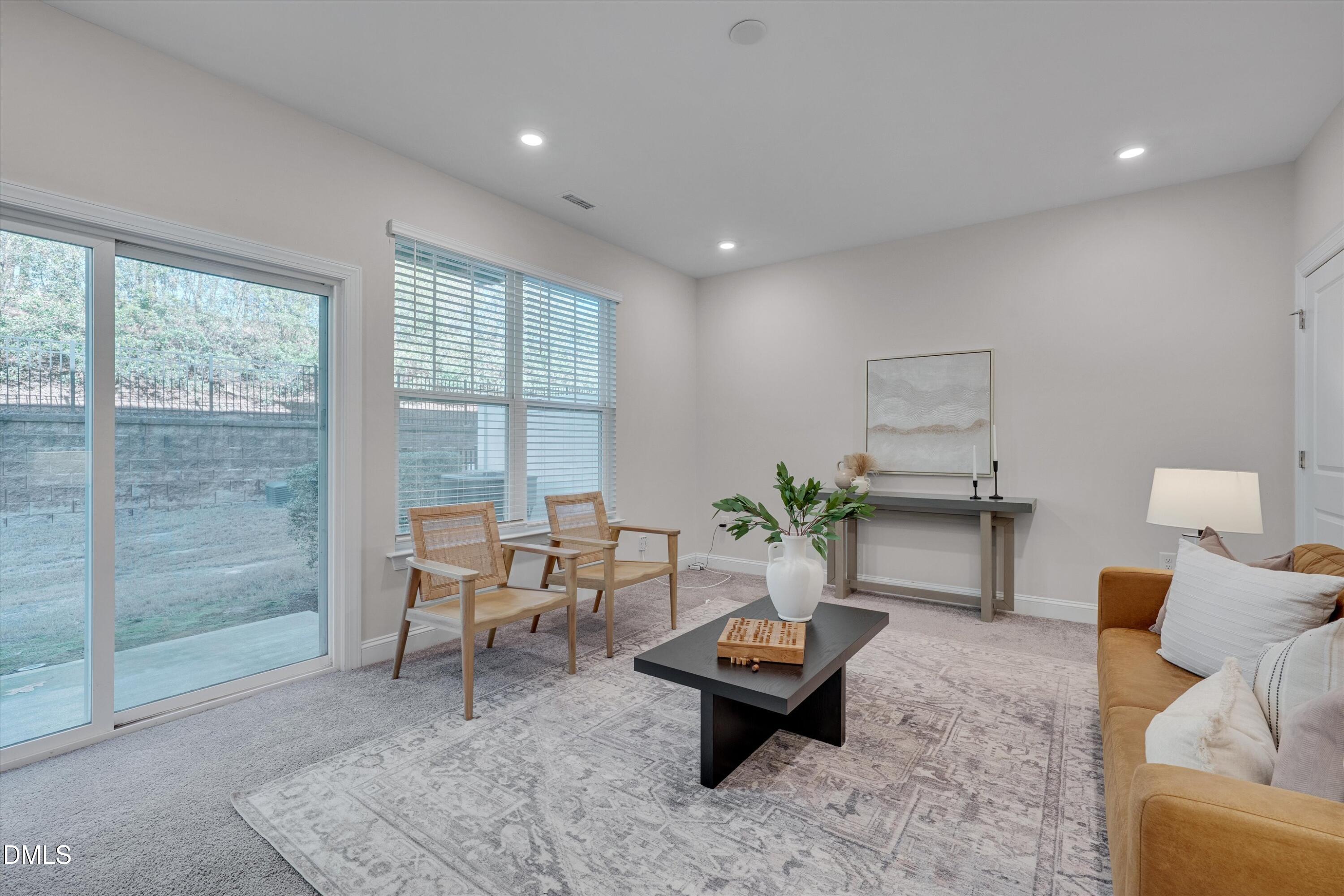 2819 Dallas Valley Lane Apex, NC 27502 - Photo 33 of 38 a living room with furniture and a table