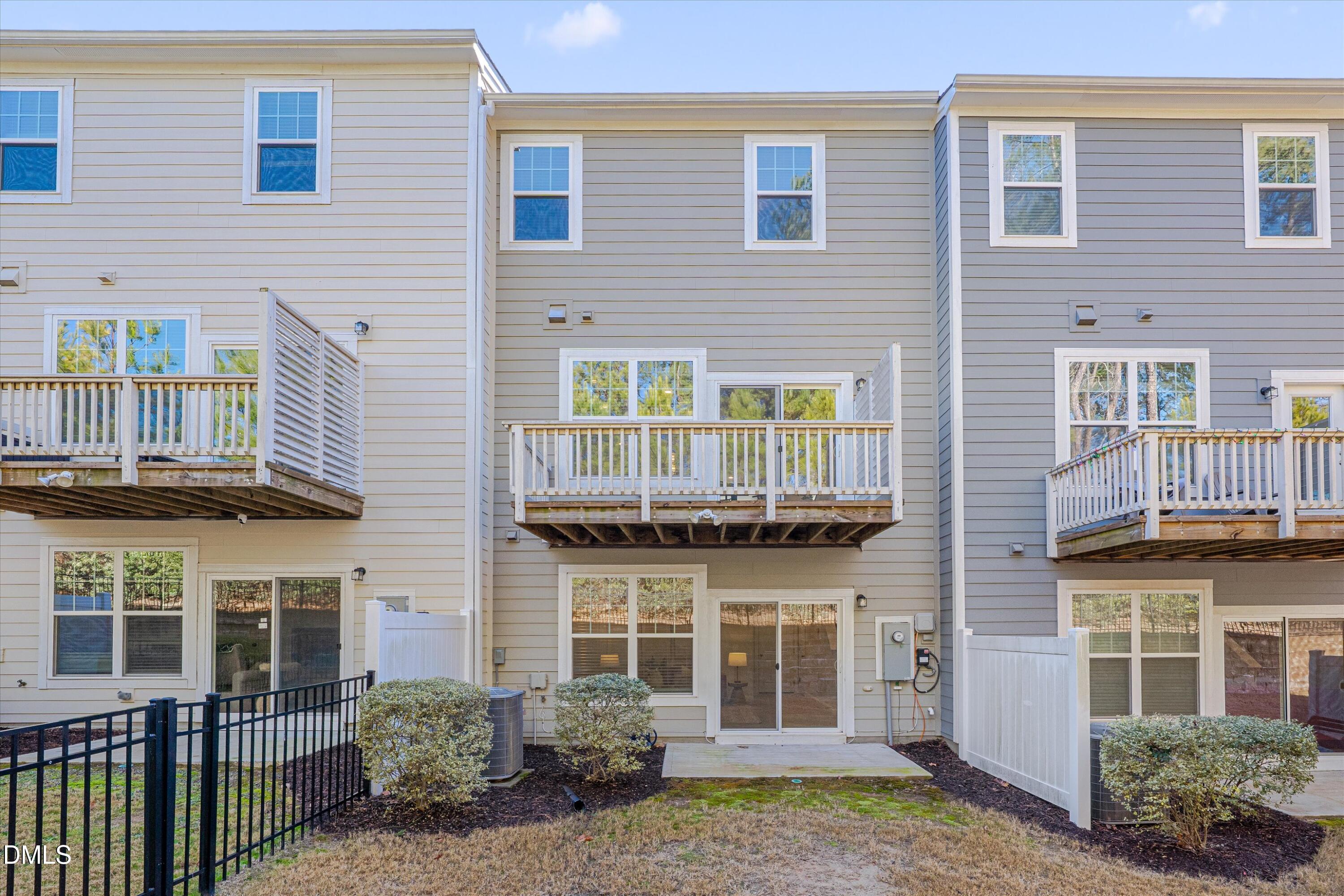 2819 Dallas Valley Lane Apex, NC 27502 - Photo 38 of 38 a view of a brick building with many windows