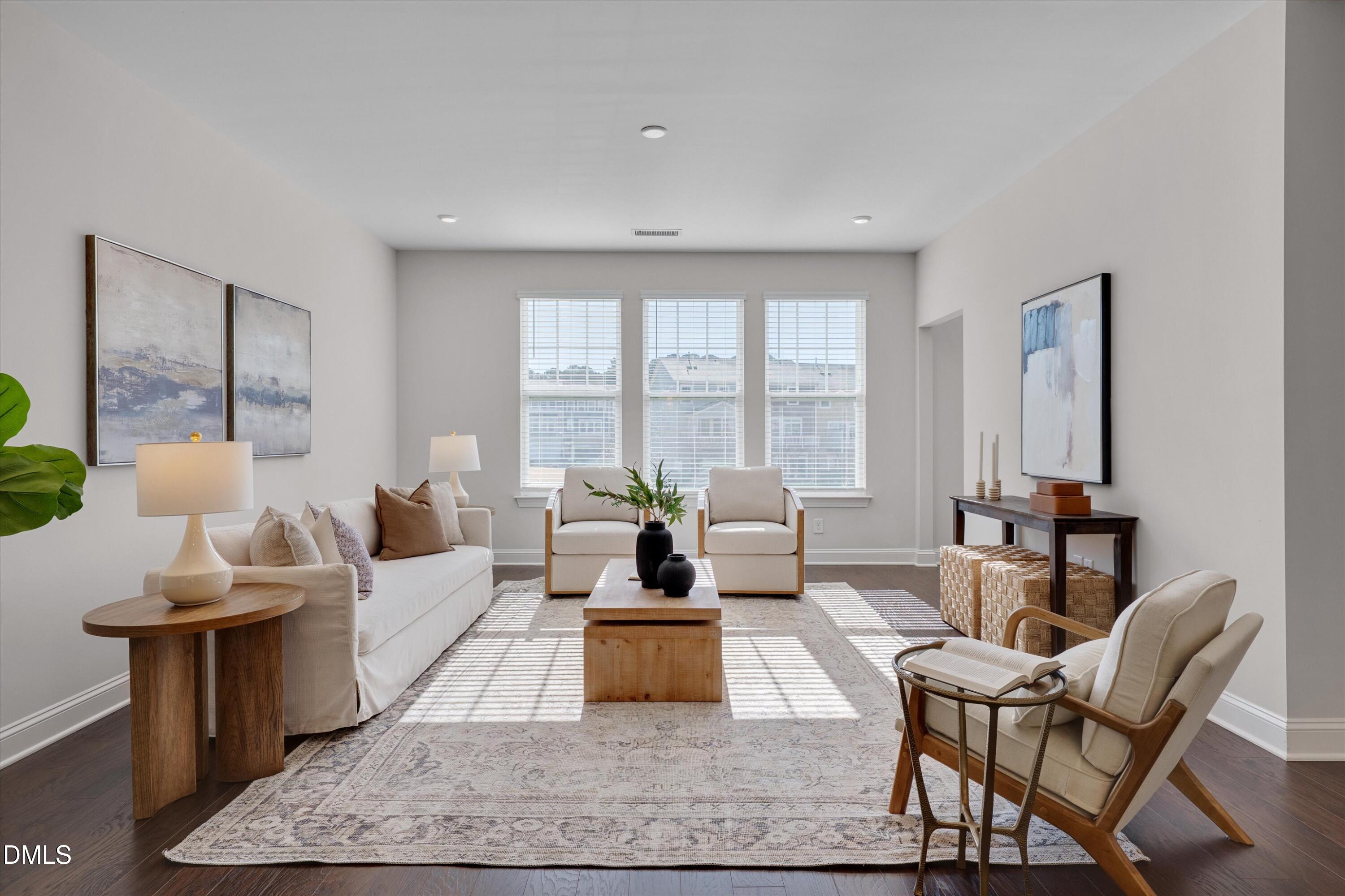 2819 Dallas Valley Lane Apex, NC 27502 - Photo 6 of 38 a living room with fireplace furniture and a large window