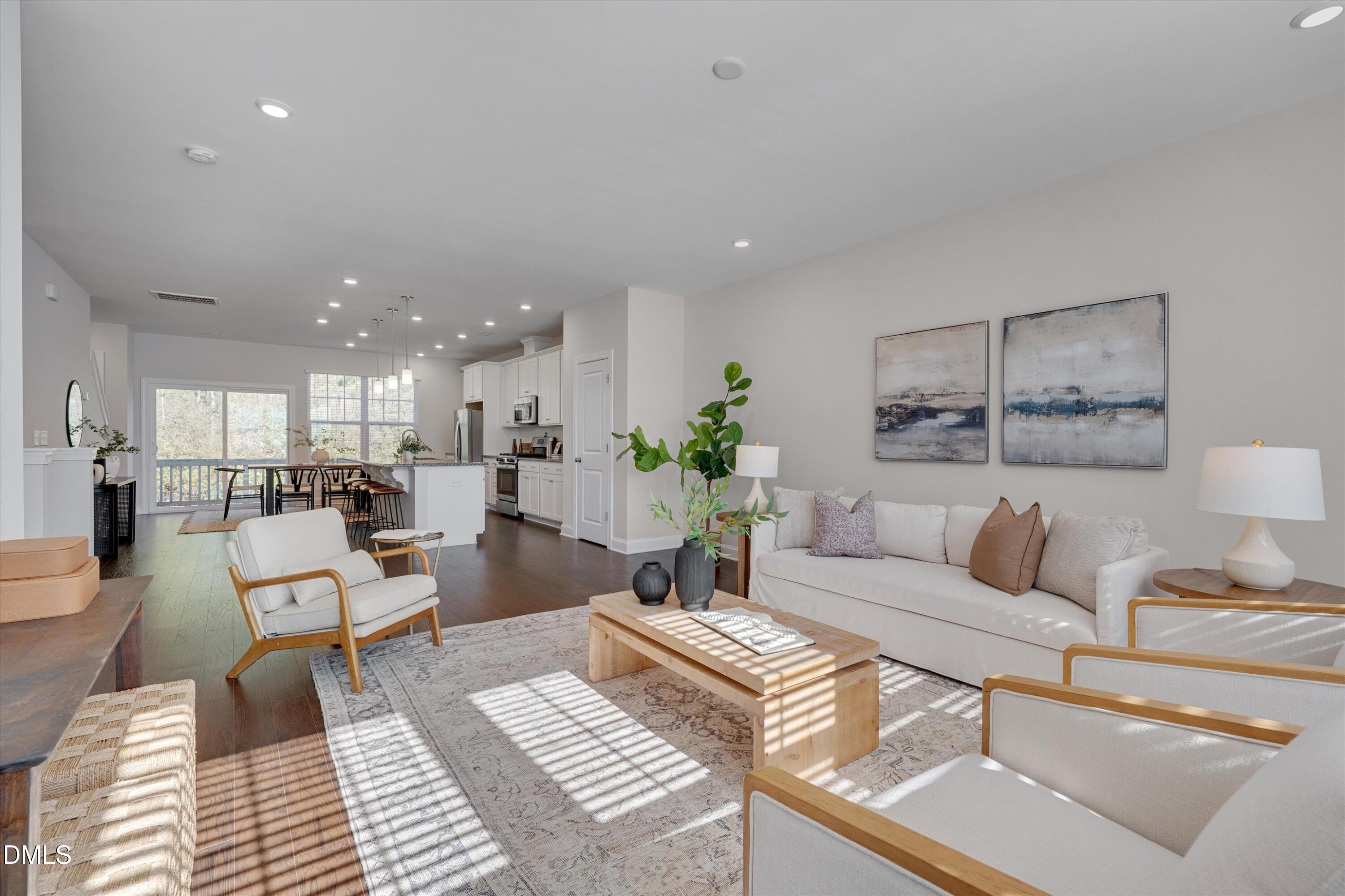 2819 Dallas Valley Lane Apex, NC 27502 - Photo 10 of 38 a living room with furniture and a view of kitchen