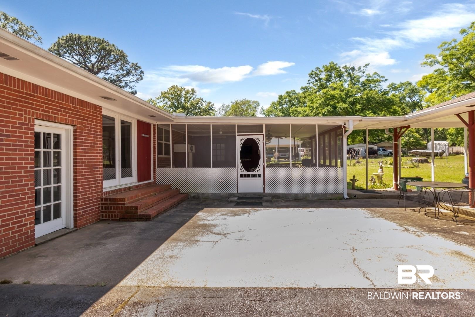 6300 Woodcrest Drive Mobile, AL 36608 - Photo 31 of 35 Doorway to property featuring a patio area and brick siding