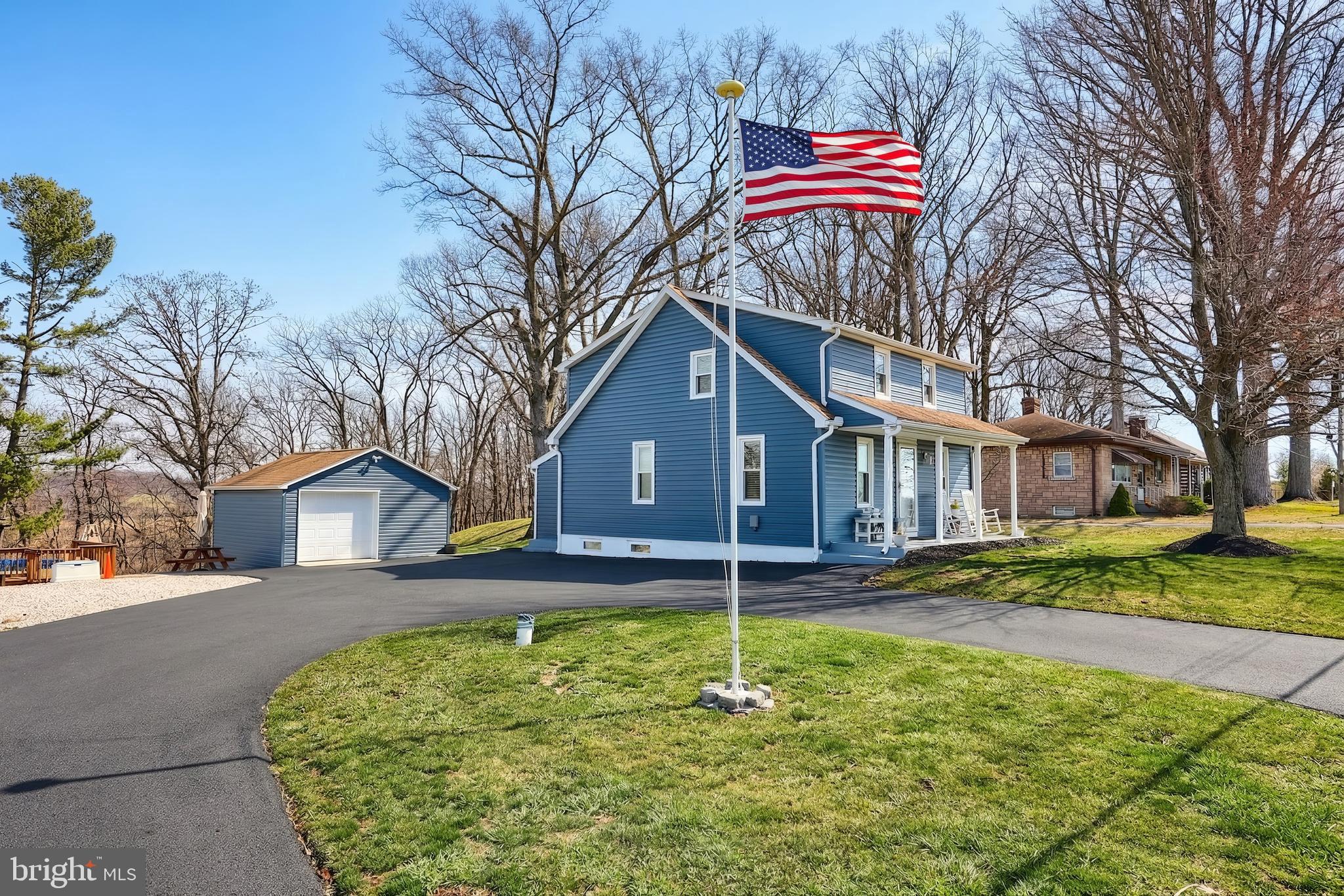 1455 Felton Road Felton, PA 17322 - Photo 1 of 35 a house with a yard and large trees