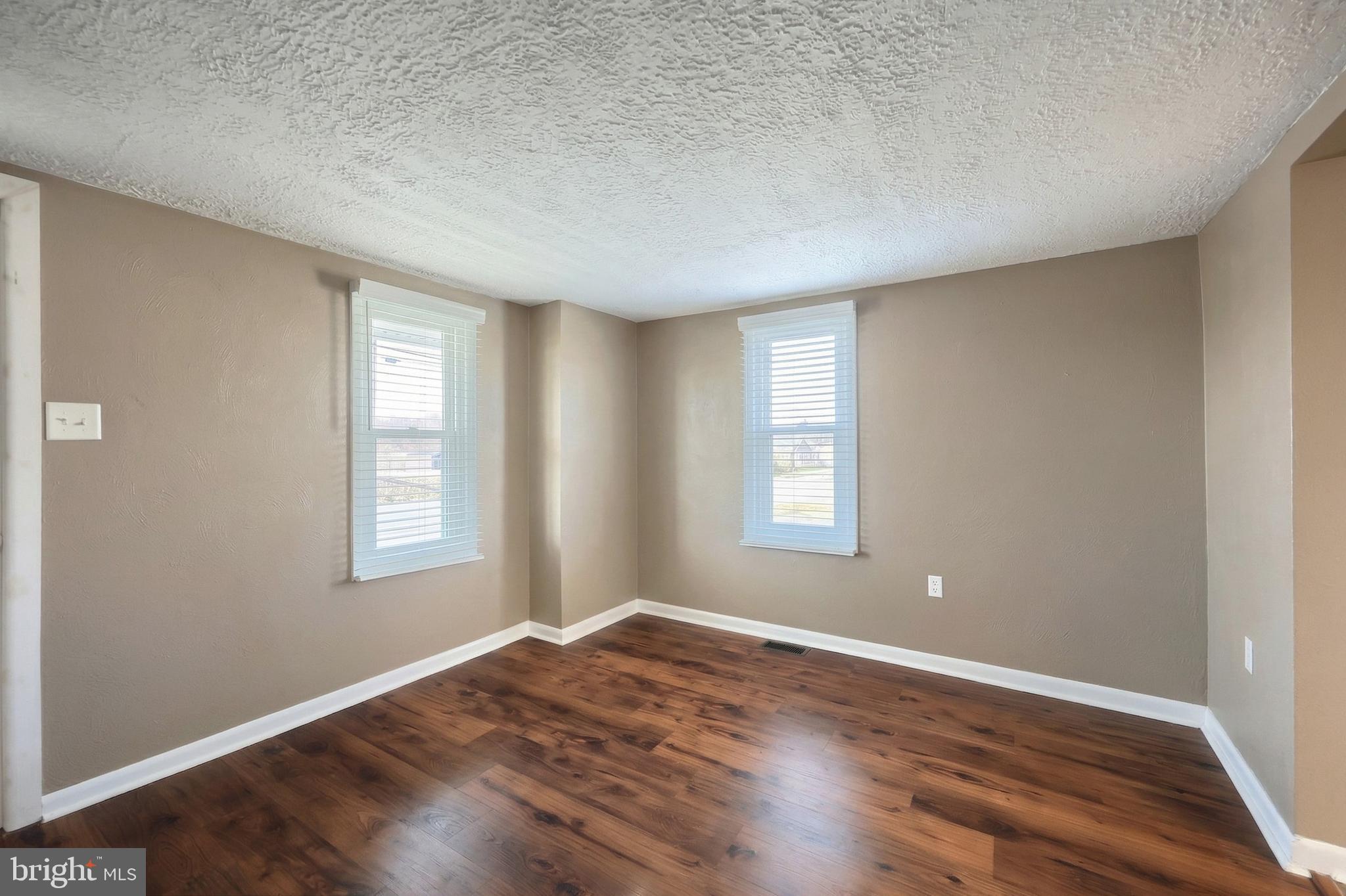 1455 Felton Road Felton, PA 17322 - Photo 11 of 35 an empty room with wooden floor and windows