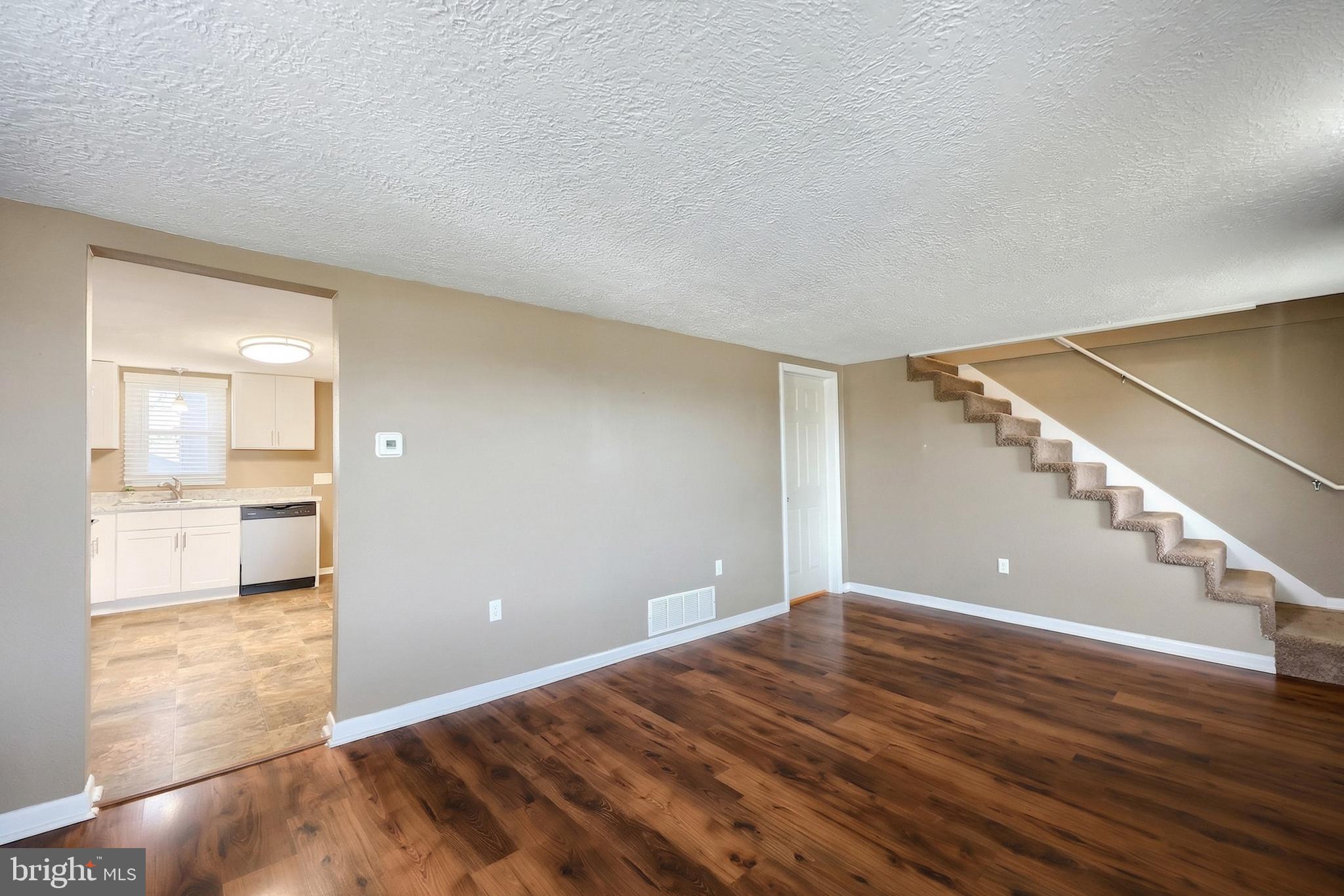 1455 Felton Road Felton, PA 17322 - Photo 12 of 35 a view of a big room with wooden floor and windows