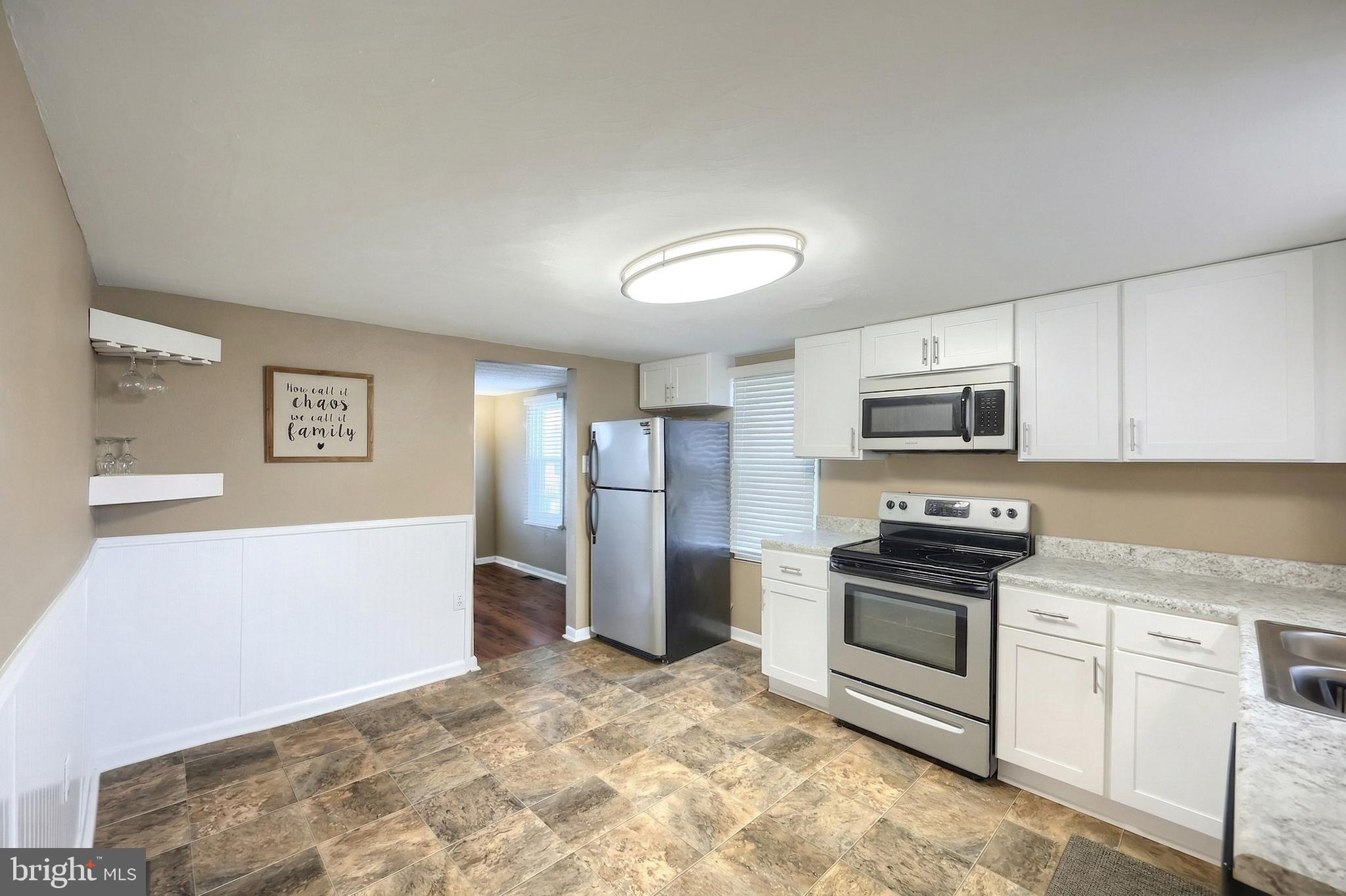 1455 Felton Road Felton, PA 17322 - Photo 14 of 35 a kitchen with stainless steel appliances a refrigerator stove and microwave