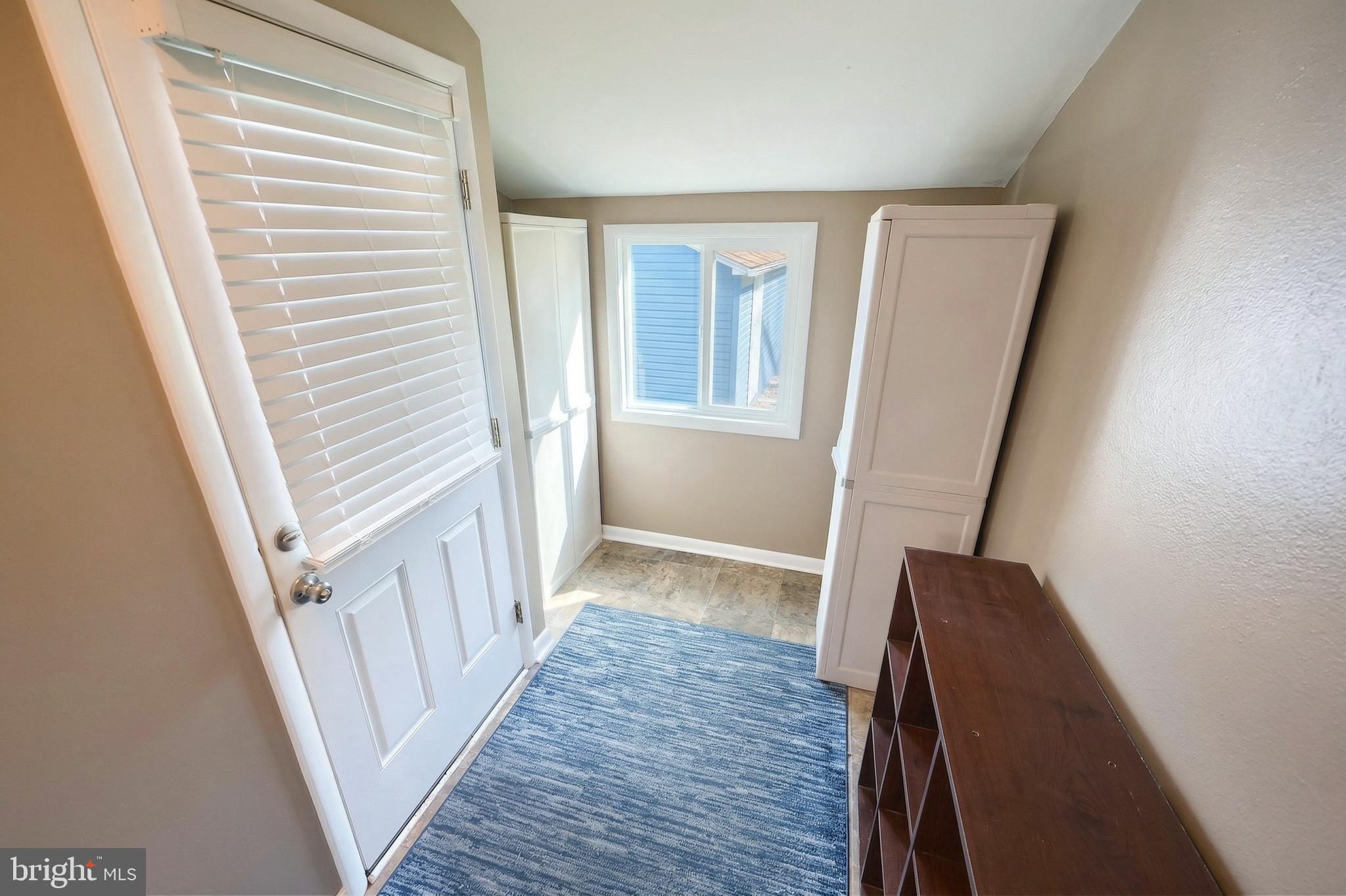 1455 Felton Road Felton, PA 17322 - Photo 17 of 35 a view of a hallway with wooden floor and staircase