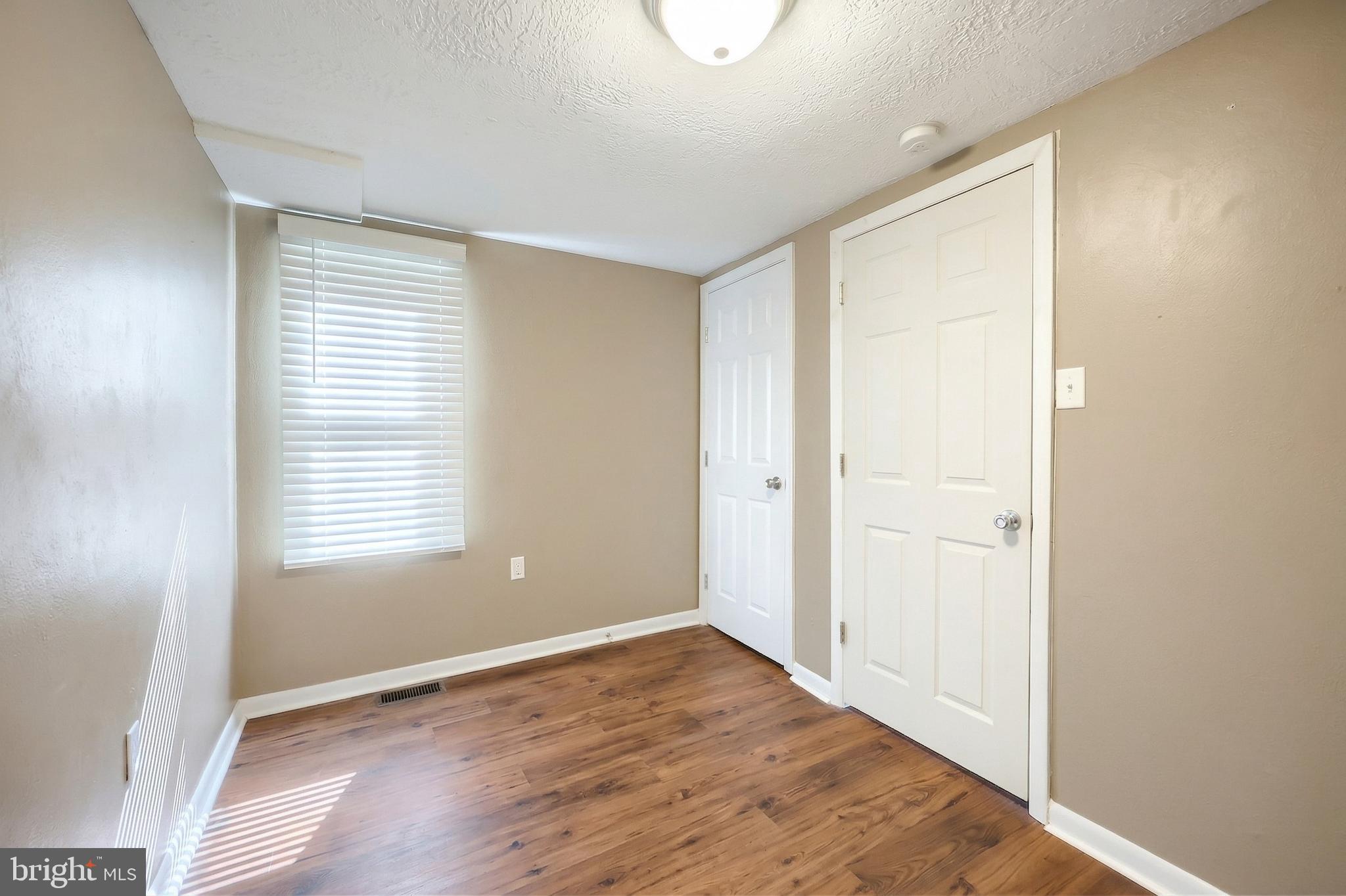 1455 Felton Road Felton, PA 17322 - Photo 19 of 35 a view of an empty room with wooden floor and a window
