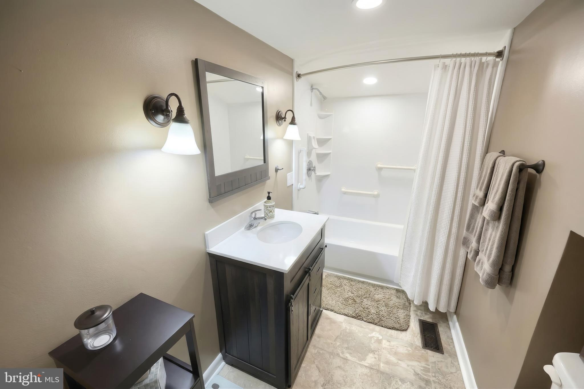 1455 Felton Road Felton, PA 17322 - Photo 24 of 35 a bathroom with a sink a toilet a mirror and shower