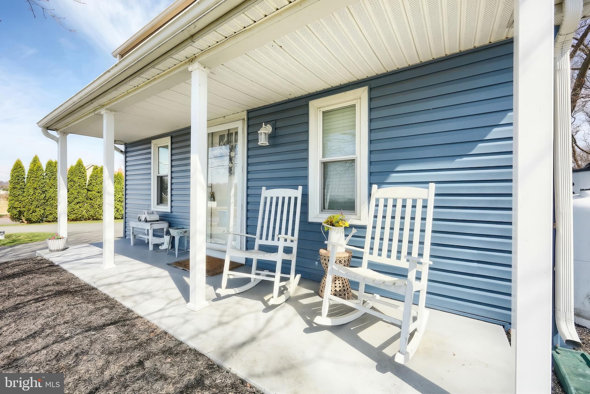 1455 Felton Road Felton, PA 17322 - Photo 8 of 35 a view of a patio with table and chairs and wooden fence