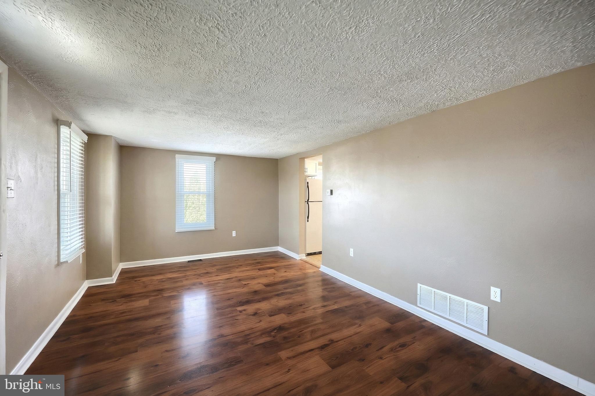 1455 Felton Road Felton, PA 17322 - Photo 10 of 35 a view of an empty room with wooden floor and a window