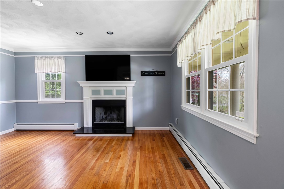 5 Victoria Lane Rehoboth, MA 02769 - Photo 22 of 48 Wood burning fireplace, and lovely oak flooring.